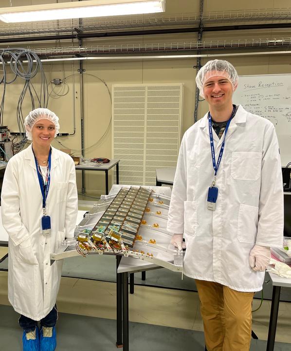 Laura and Kees standing in front of three ITk staves